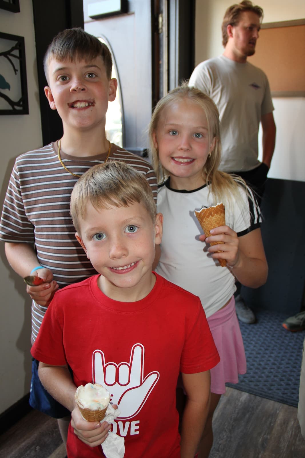 Three kids with cones and rock-and-roll spirit